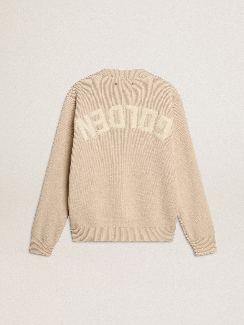 Women's beige sweater with 'Golden' lettering on the back