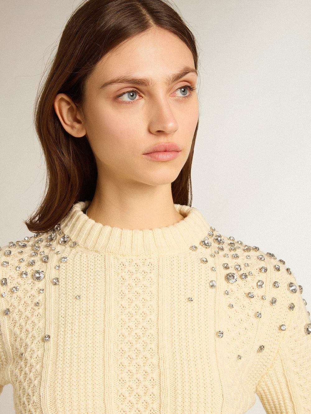 Women's cropped worn-white sweater with decorative crystals