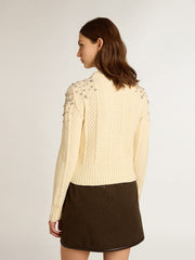 Women's cropped worn-white sweater with decorative crystals