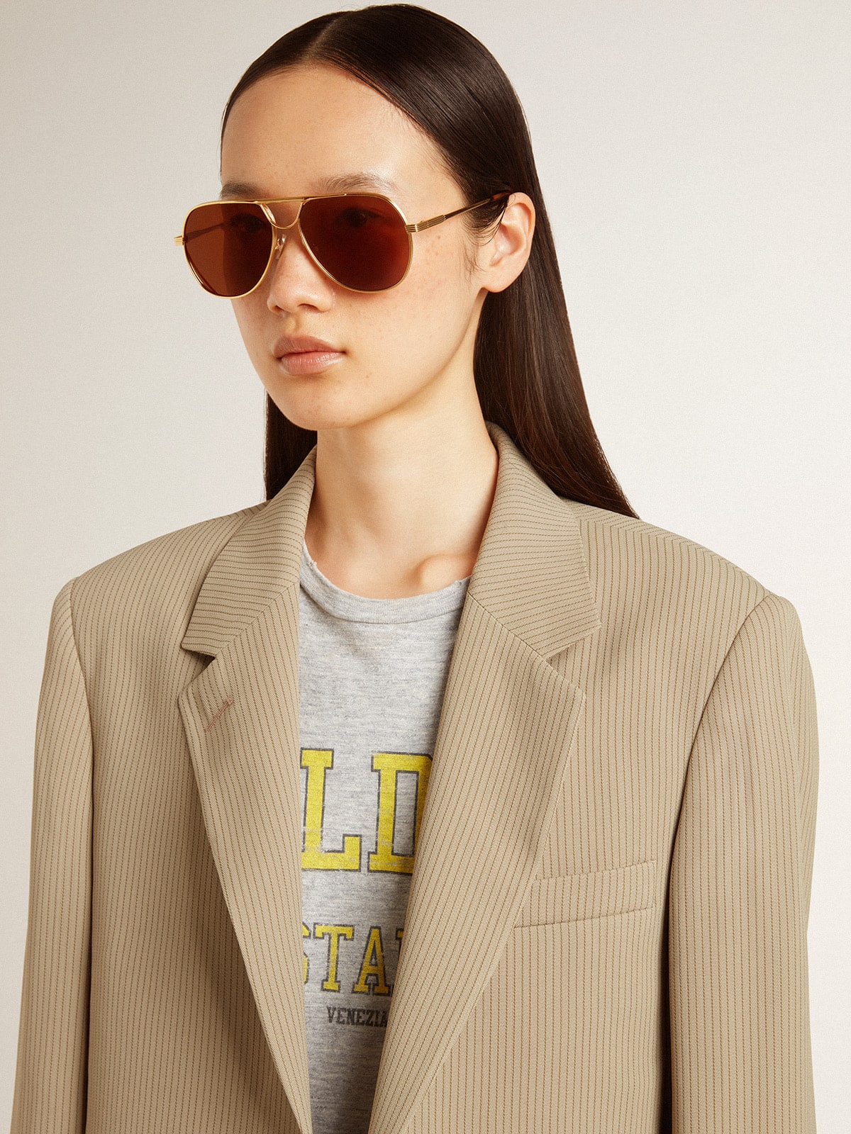 Women's beige pinstripe single-breasted jacket with an oversized fit