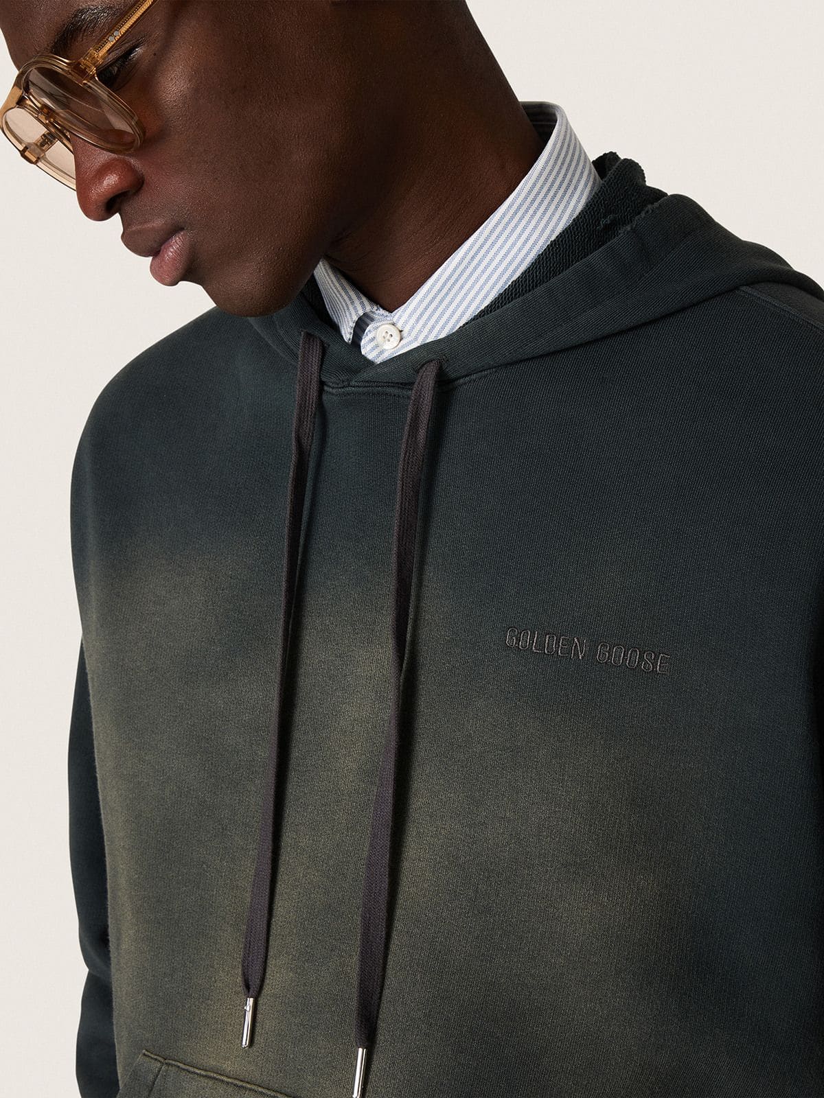 Unisex hooded sweatshirt in black cotton with a bleached effect