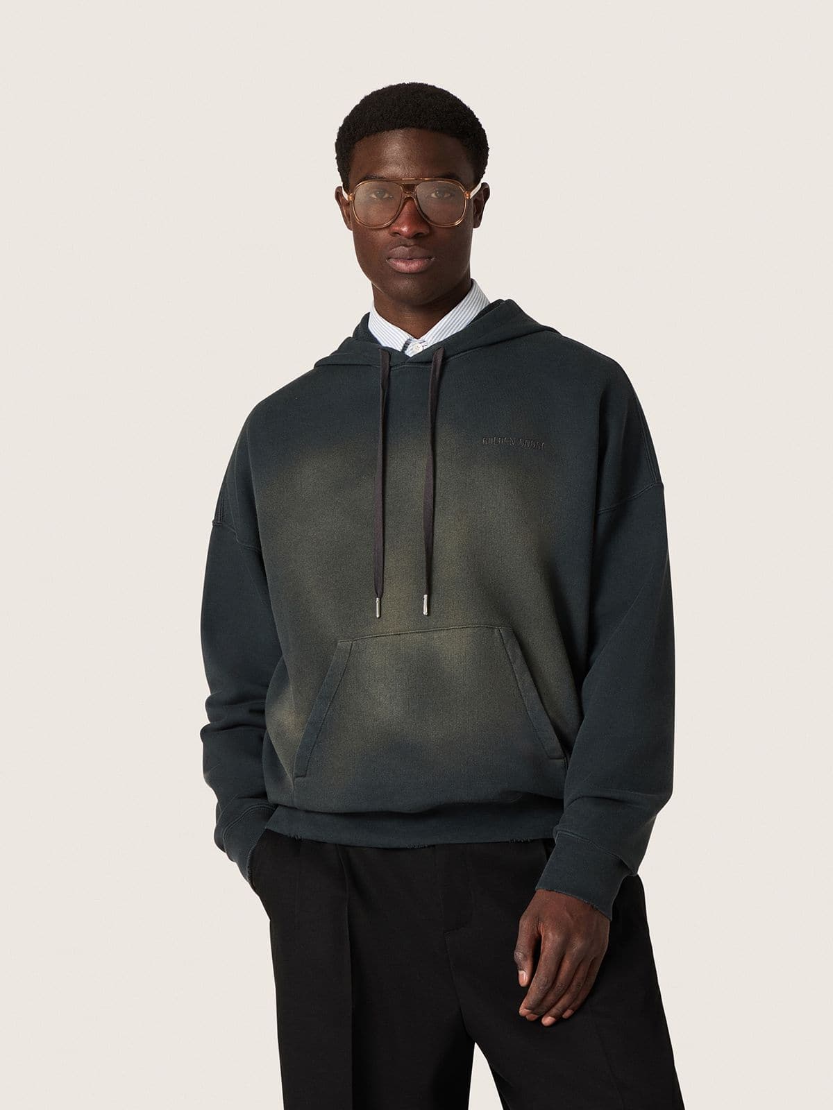 Unisex hooded sweatshirt in black cotton with a bleached effect