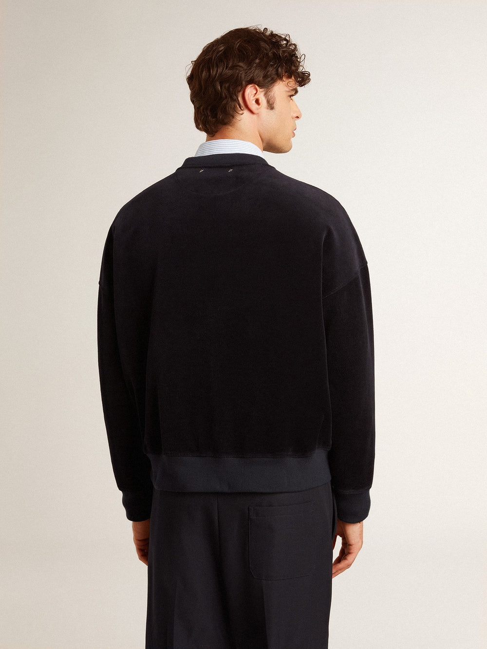 Black crew neck sweatshirt with embroidered lettering