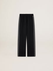 Women’s black joggers with white stars on the sides