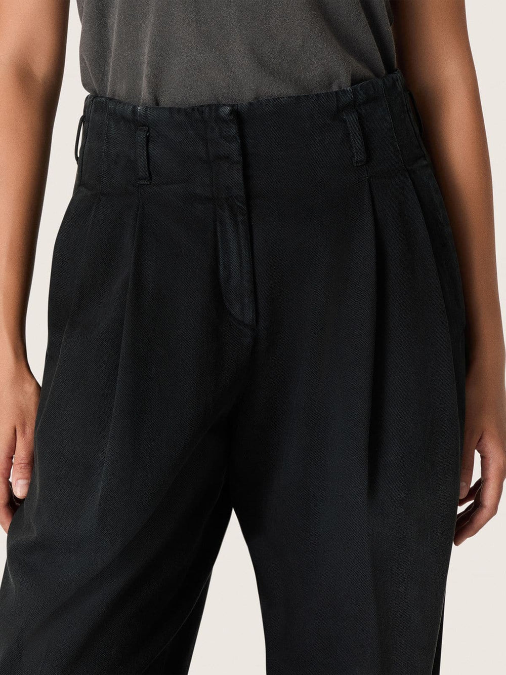 Women's pants in black cotton denim with a lived-in treatment