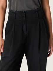 Women's pants in black cotton denim with a lived-in treatment