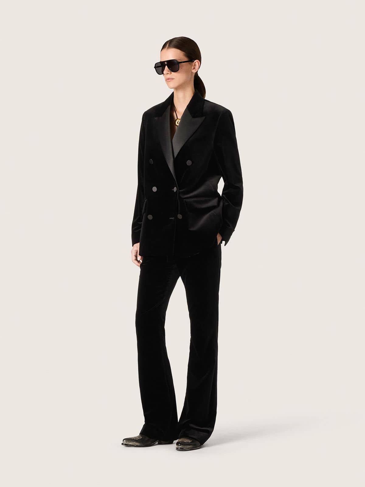 Women's slim-fit flared pants in black cotton velvet