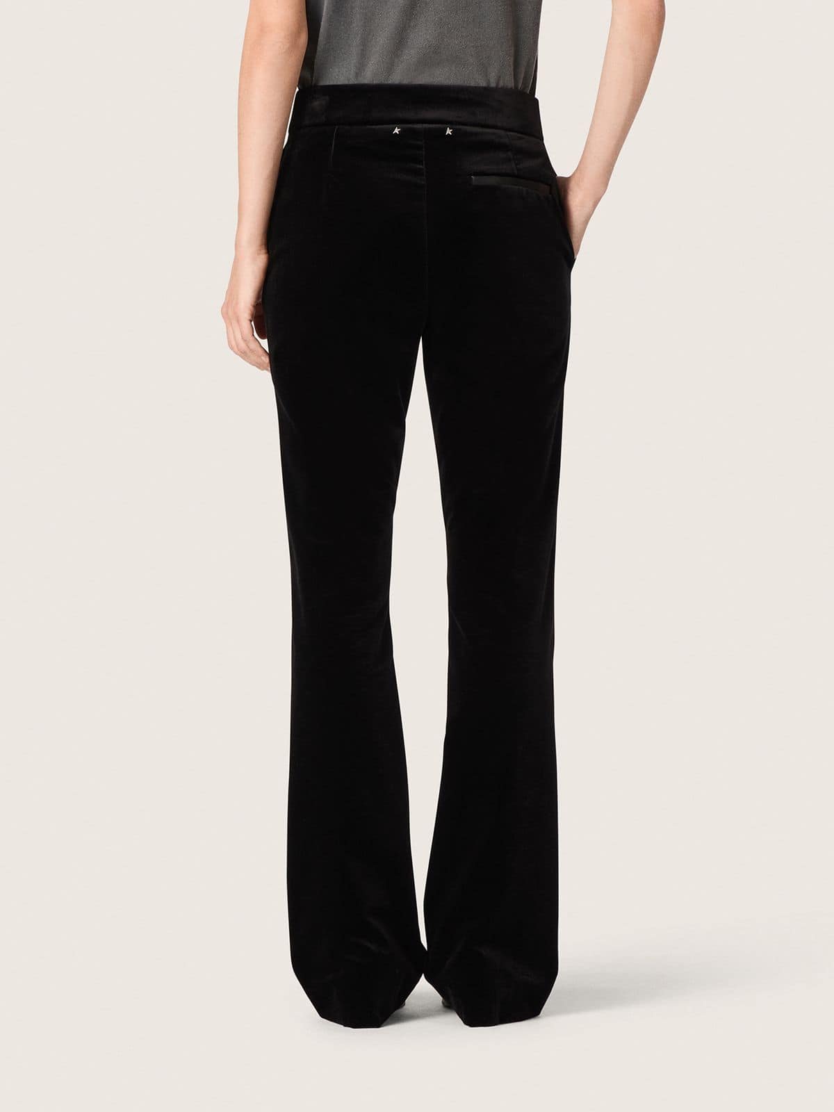 Women's slim-fit flared pants in black cotton velvet