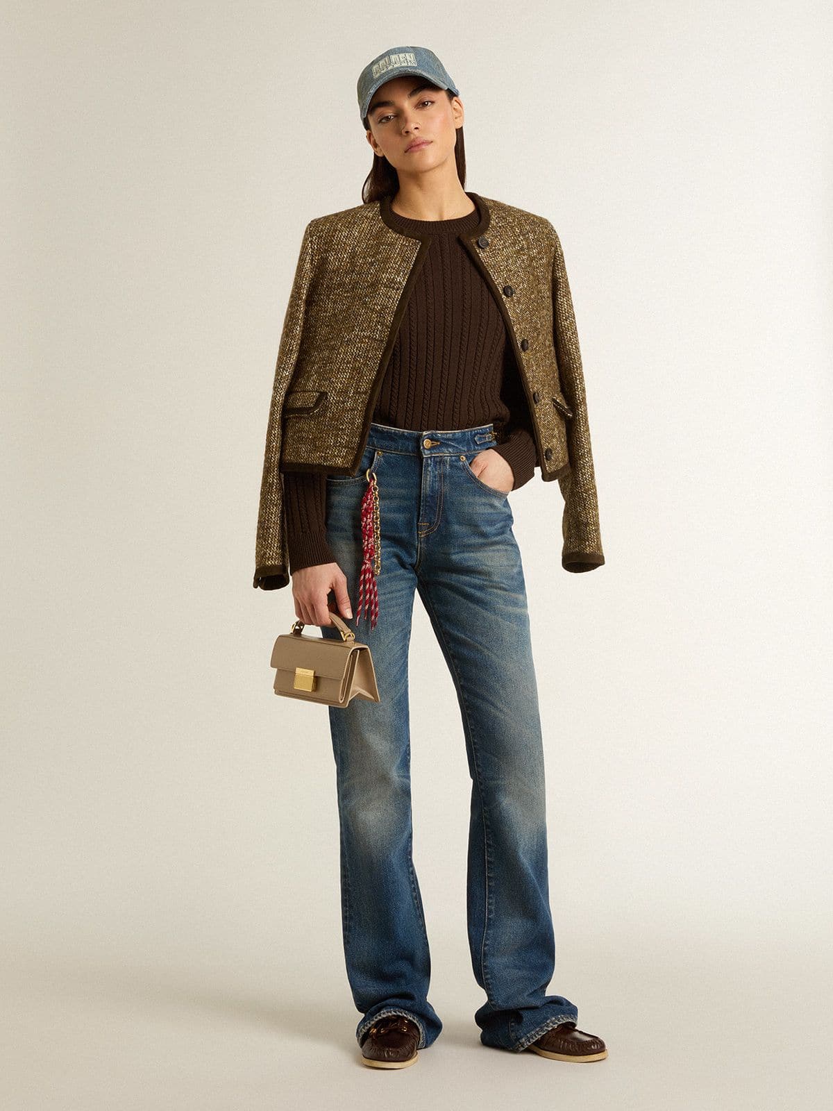 Women's bootcut jeans with a vintage wash and metallic details