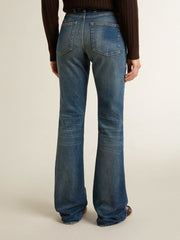 Women's bootcut jeans with a vintage wash and metallic details