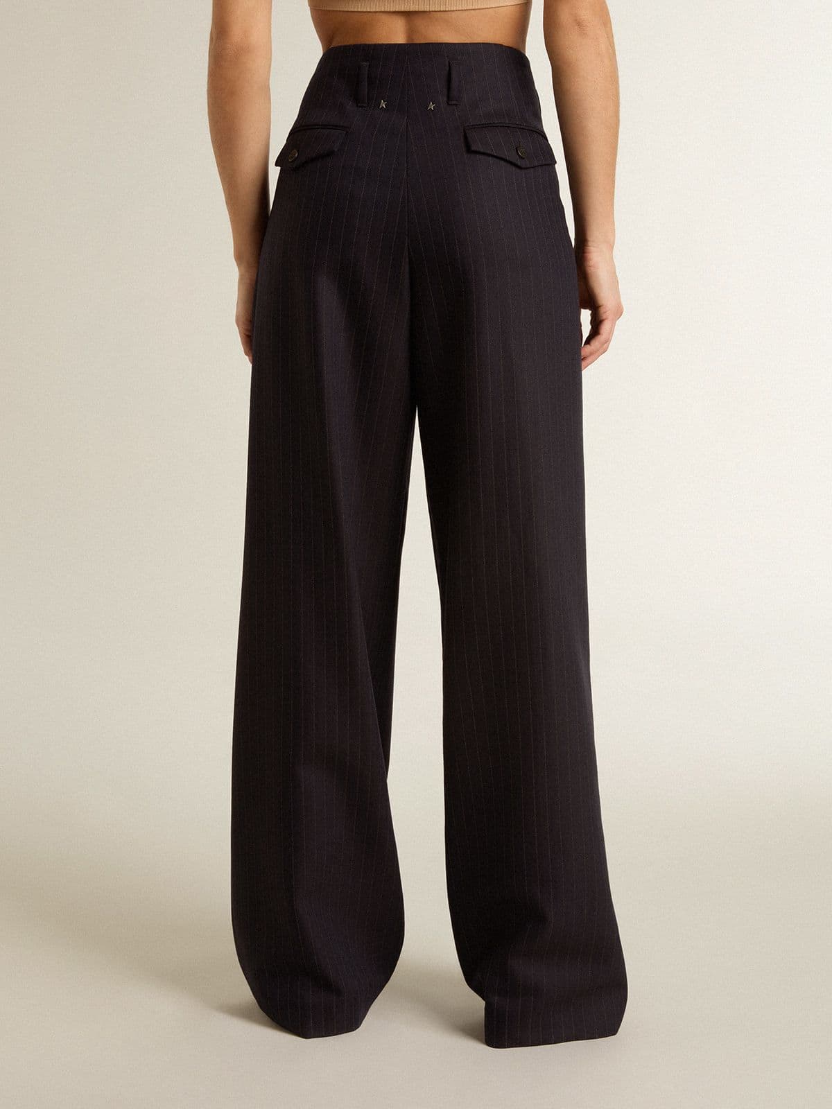 Women’s dark blue tailored trousers with vertical stripe