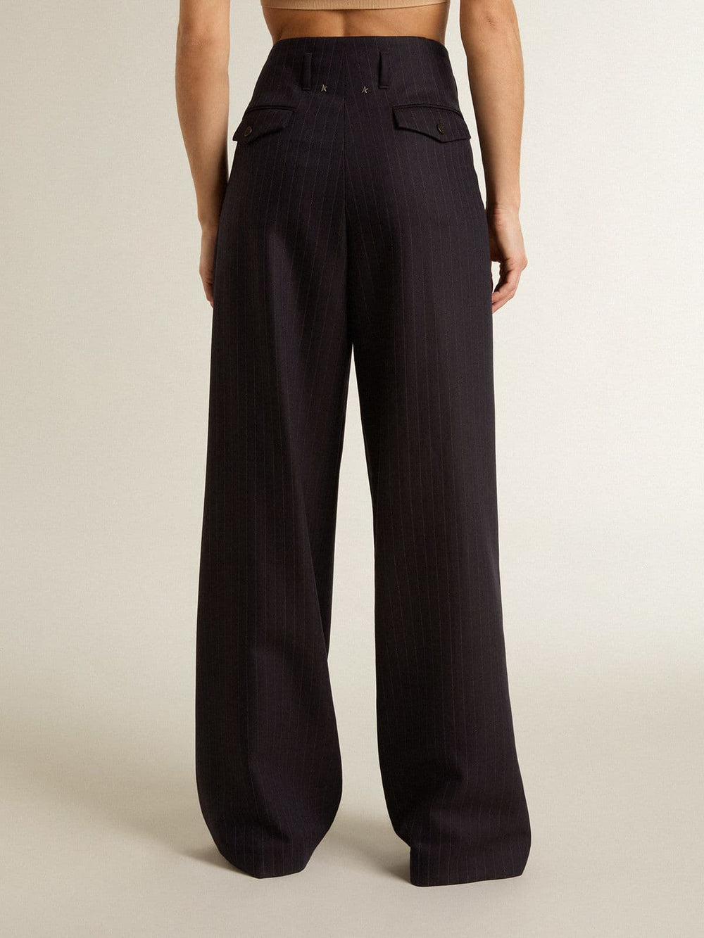 Women’s dark blue tailored trousers with vertical stripe