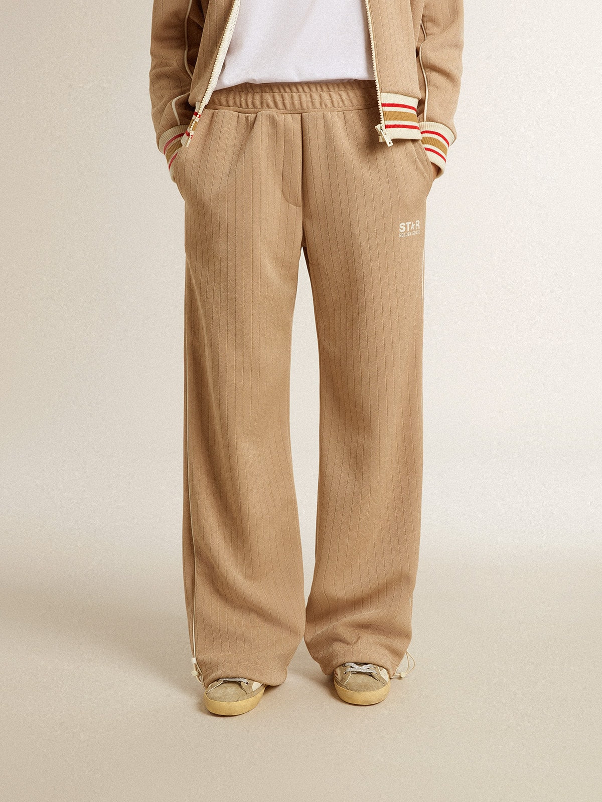 Women’s light beige joggers with white logo