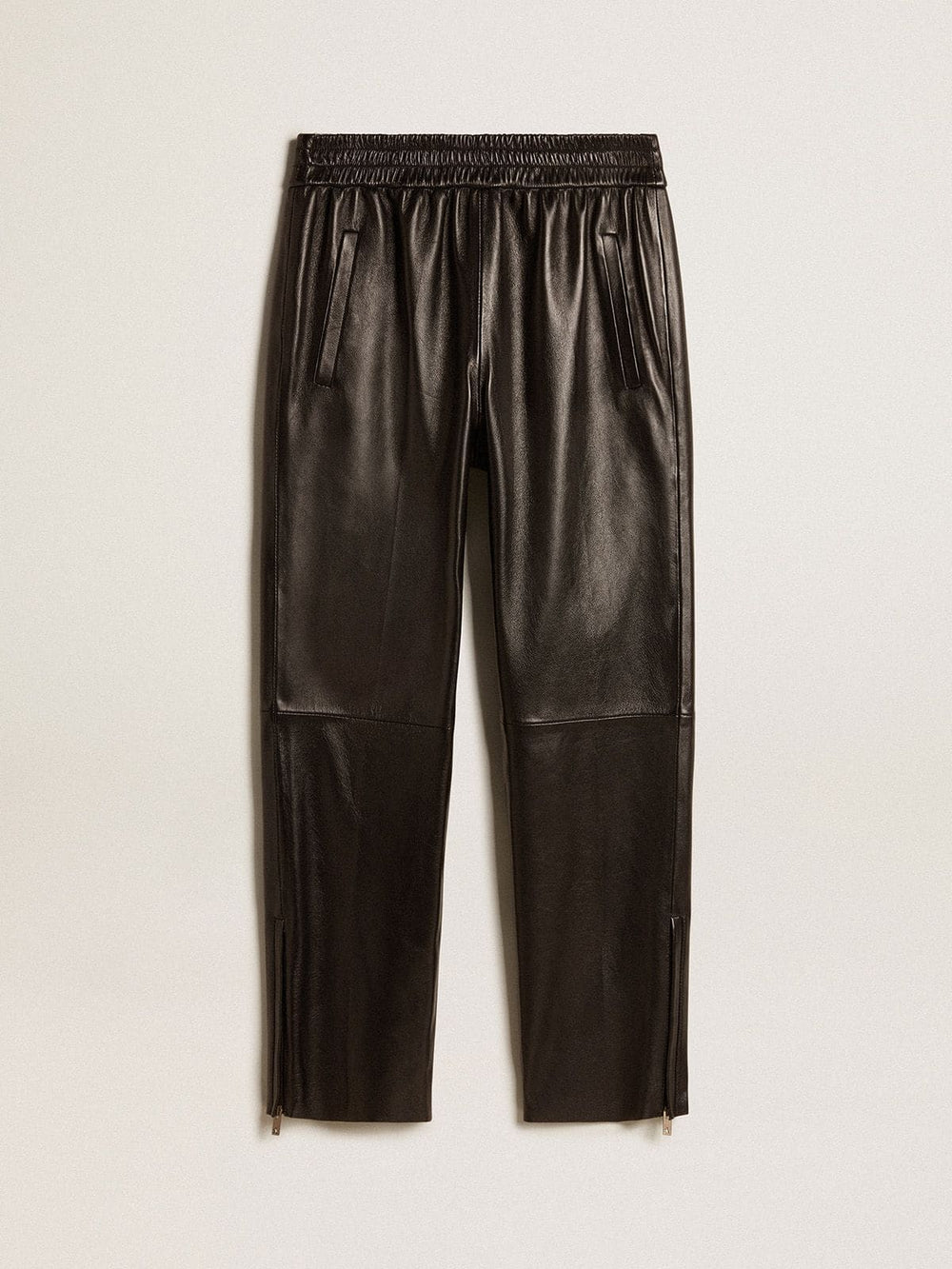 Black joggers in nappa leather with zip at the base