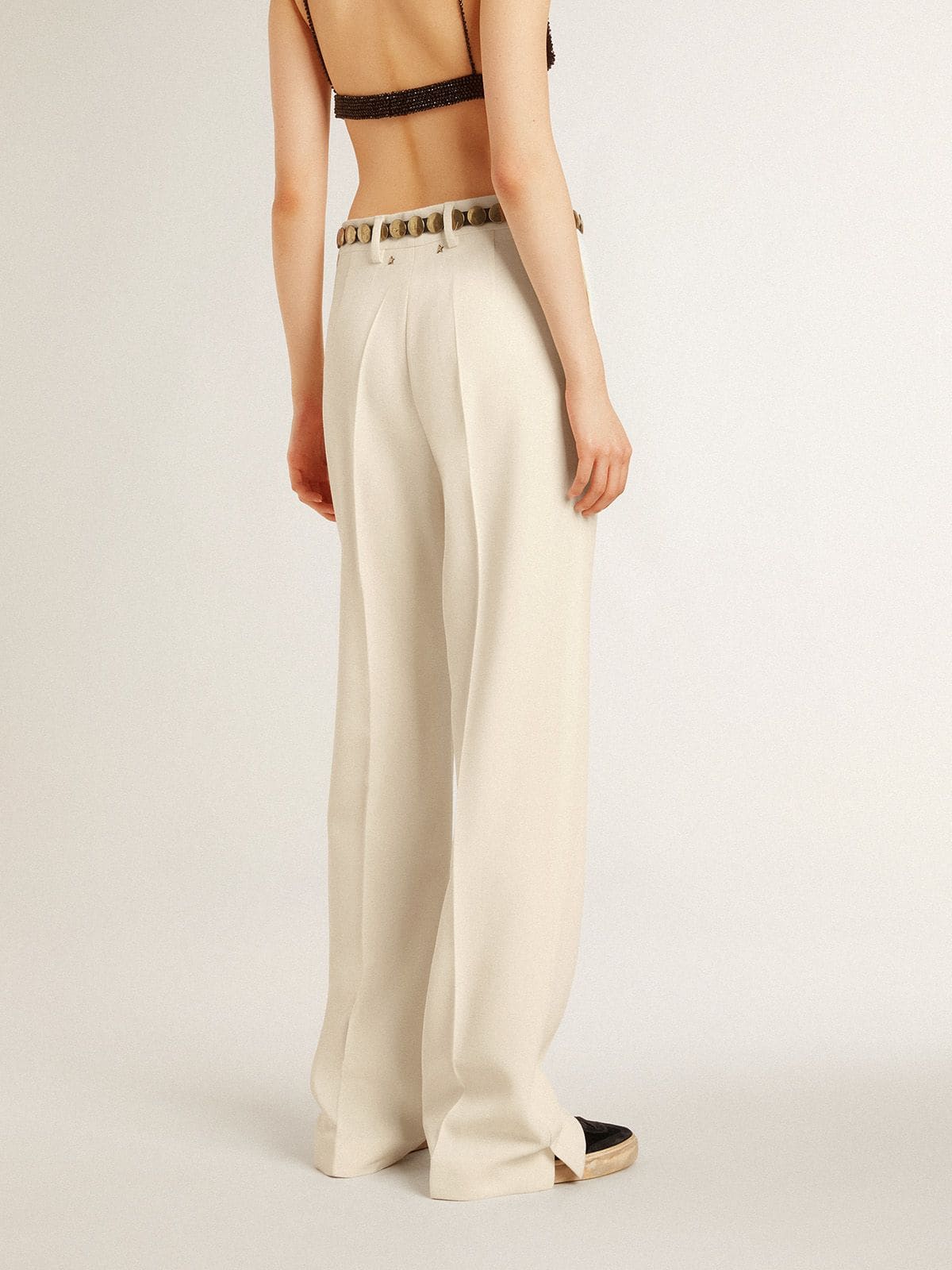 Women's loose pants in worn-white tailored fabric