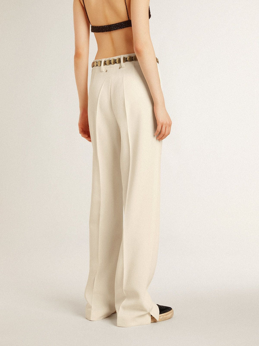 Women's loose pants in worn-white tailored fabric
