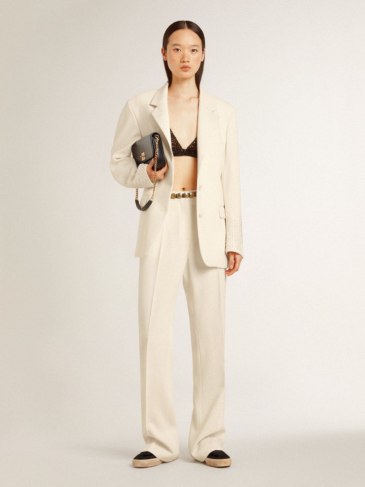 Women's loose pants in worn-white tailored fabric