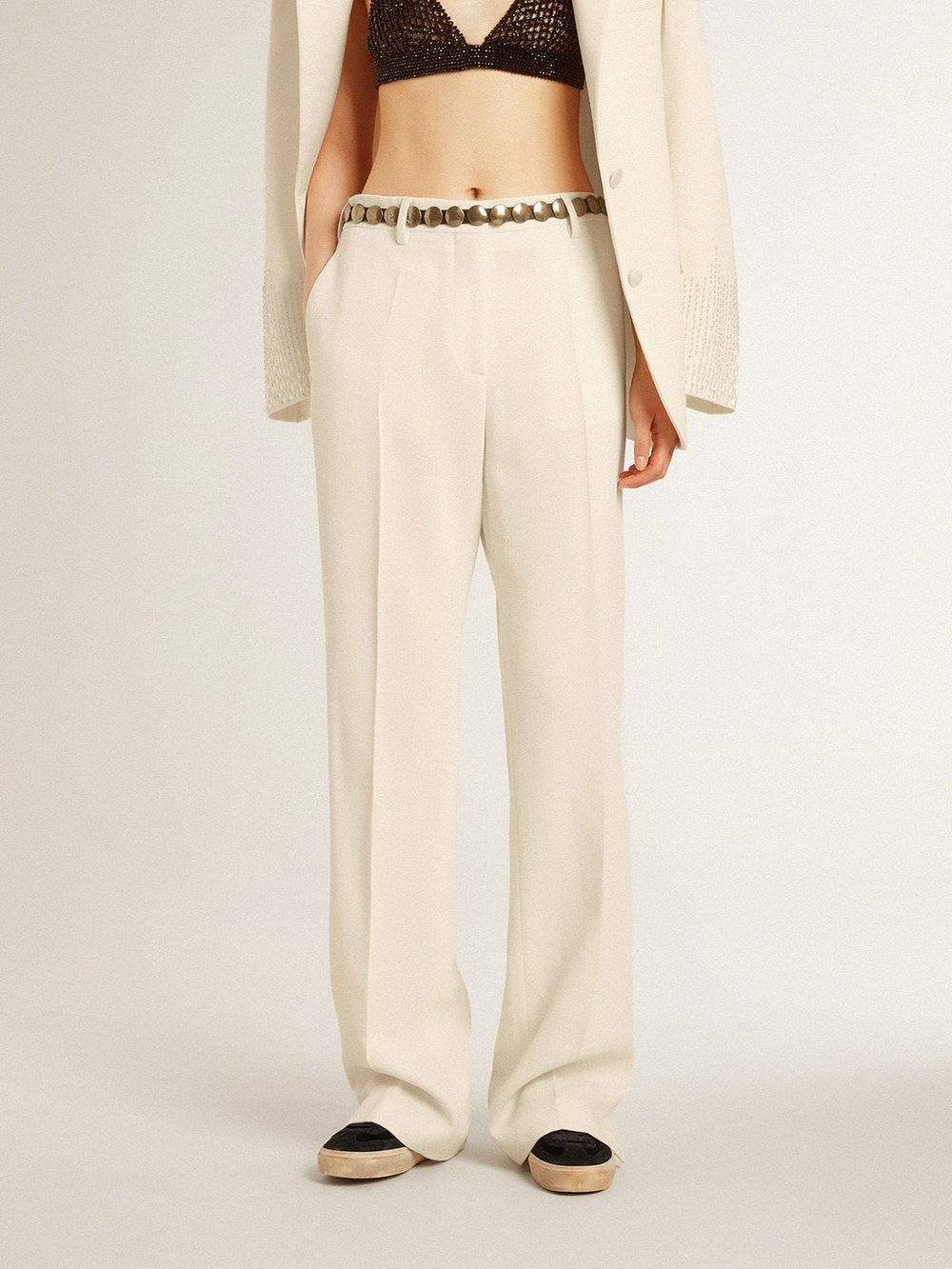 Women's loose pants in worn-white tailored fabric