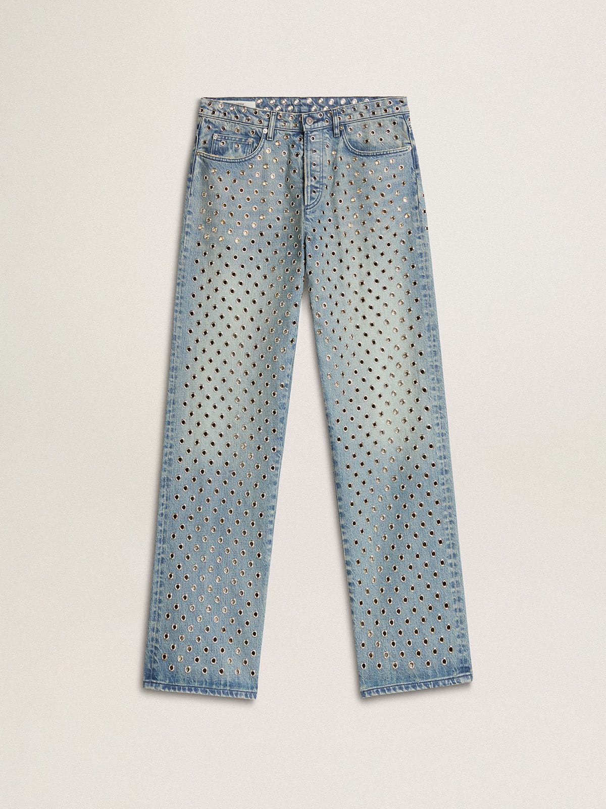 Women's washed jeans with all-over eyelets