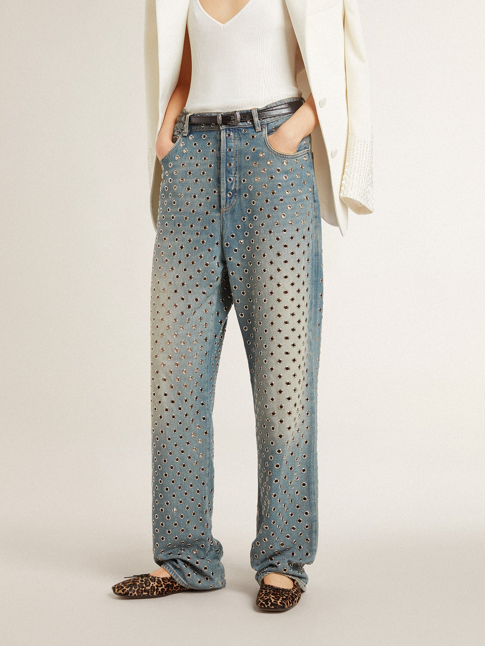 Women's washed jeans with all-over eyelets