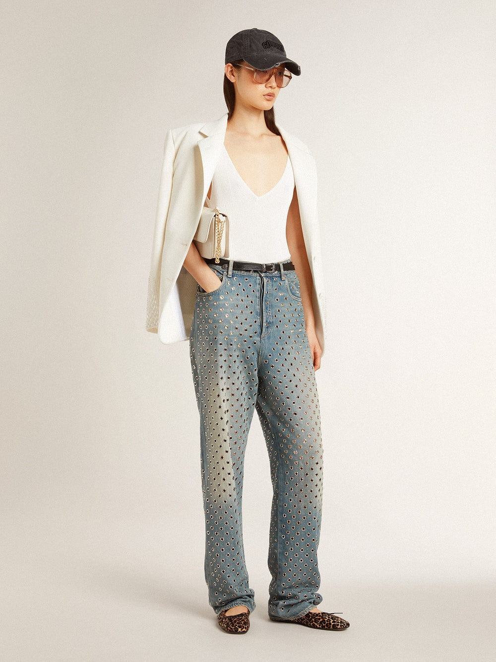 Women's washed jeans with all-over eyelets