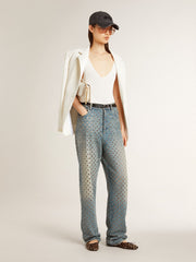 Women's washed jeans with all-over eyelets