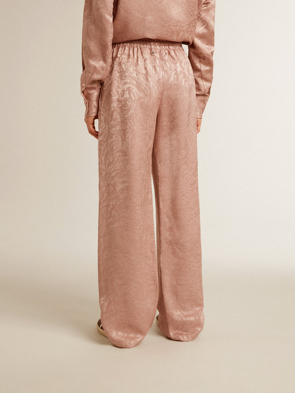 Women's pink viscose pants with floral pattern