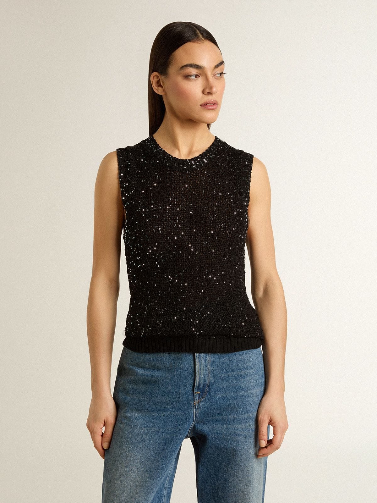 Black mesh knit top with sequins and contrasting details
