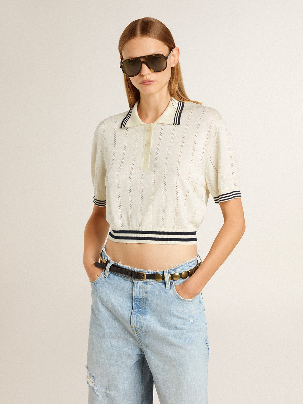 Women's cropped worn-white cotton polo shirt with blue ribbing