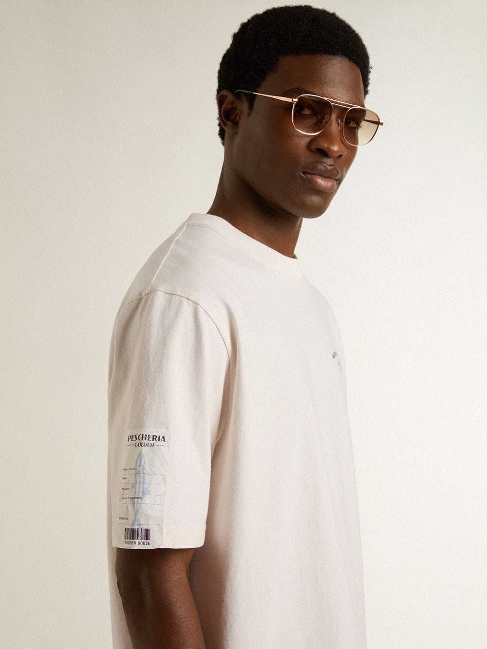 White unisex T-shirt with Mediterranean print and Pescheria Golden patch on the sleeve