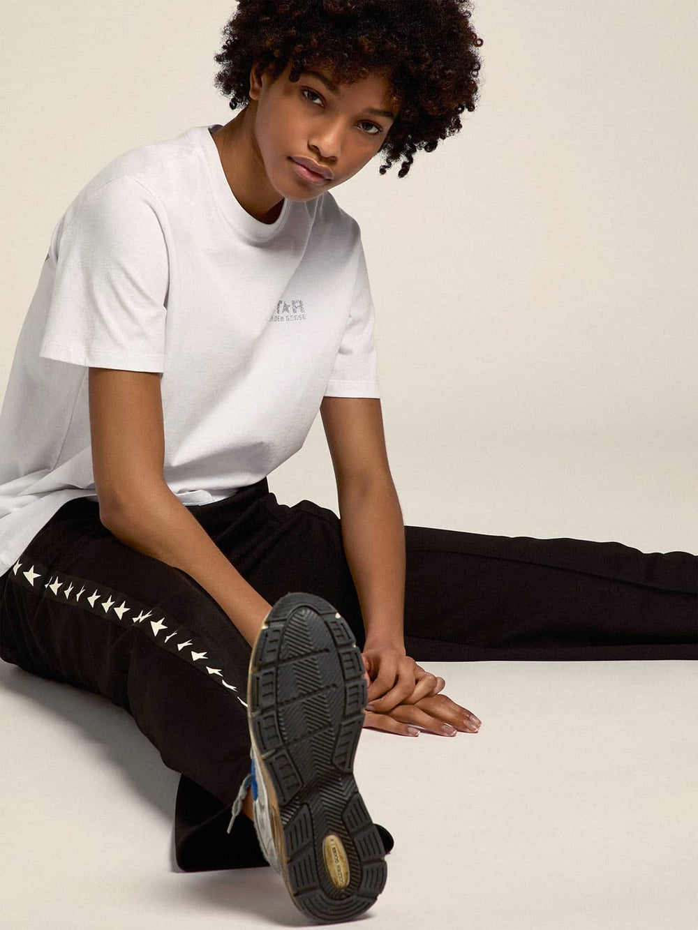 Women's white T-shirt with silver glitter logo and star