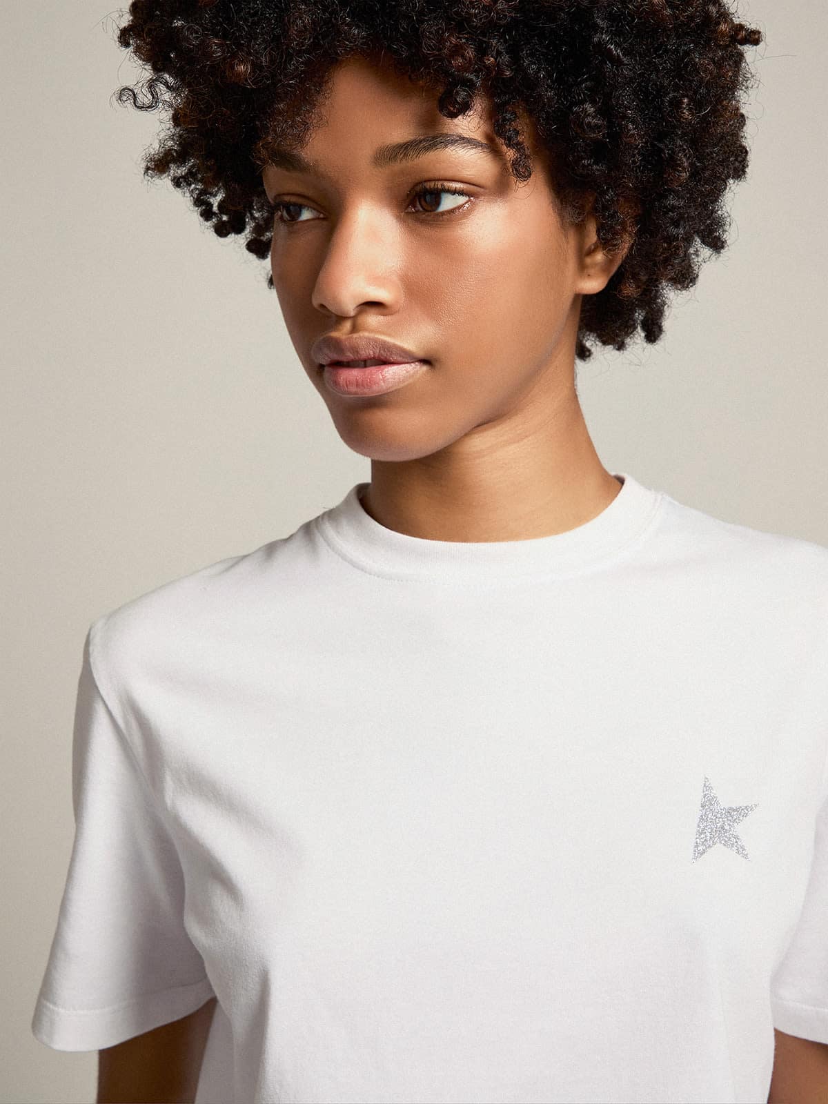 Women's white T-shirt with silver glitter star on the front