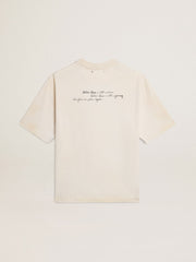 Worn-white unisex T-shirt with printed lettering