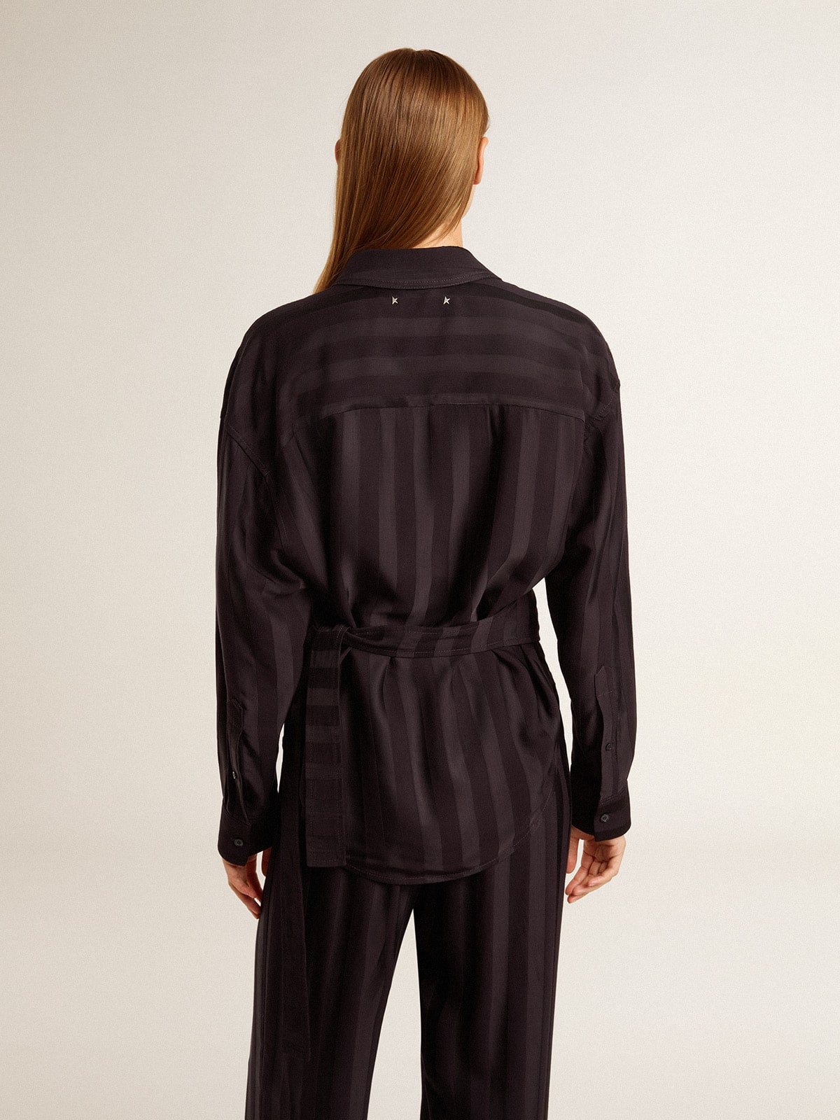Women's black shirt with vertical stripes and side knot closure