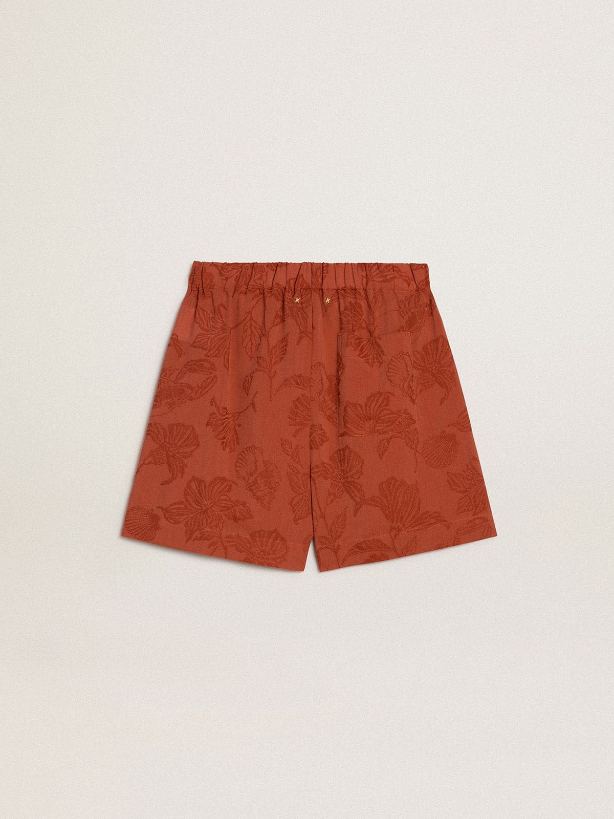 Women's shorts in brick-red jacquard with marine floral pattern