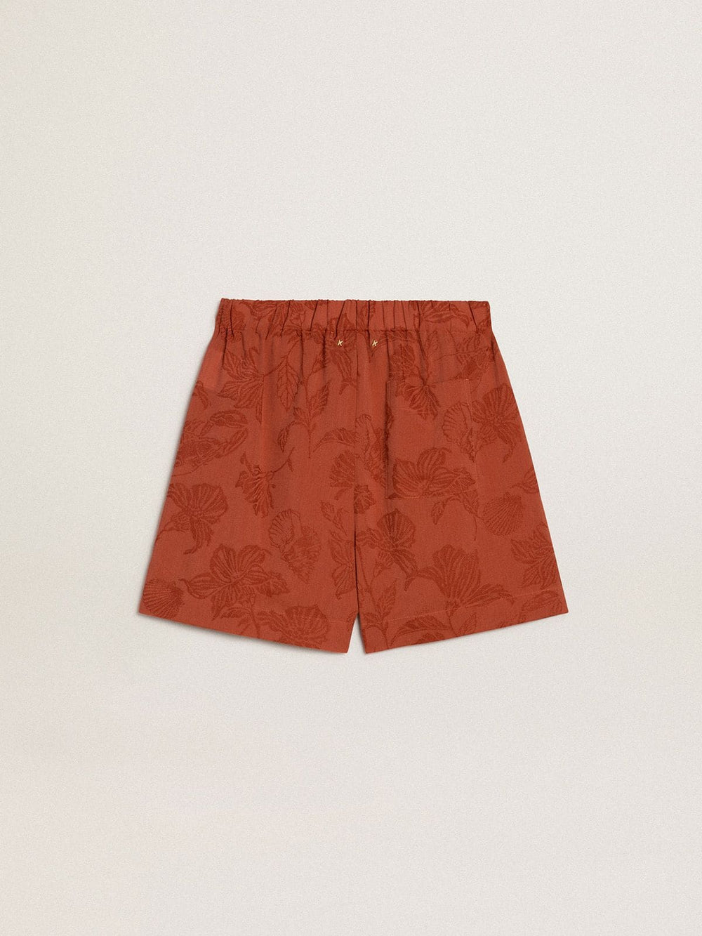Women's shorts in brick-red jacquard with marine floral pattern