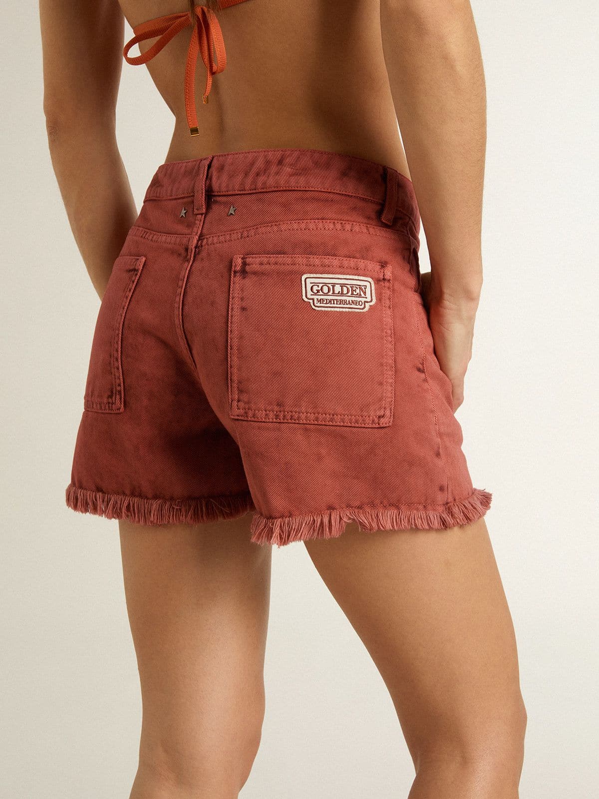 Women's shorts in brick-red denim with Golden Mediterraneo embroidery