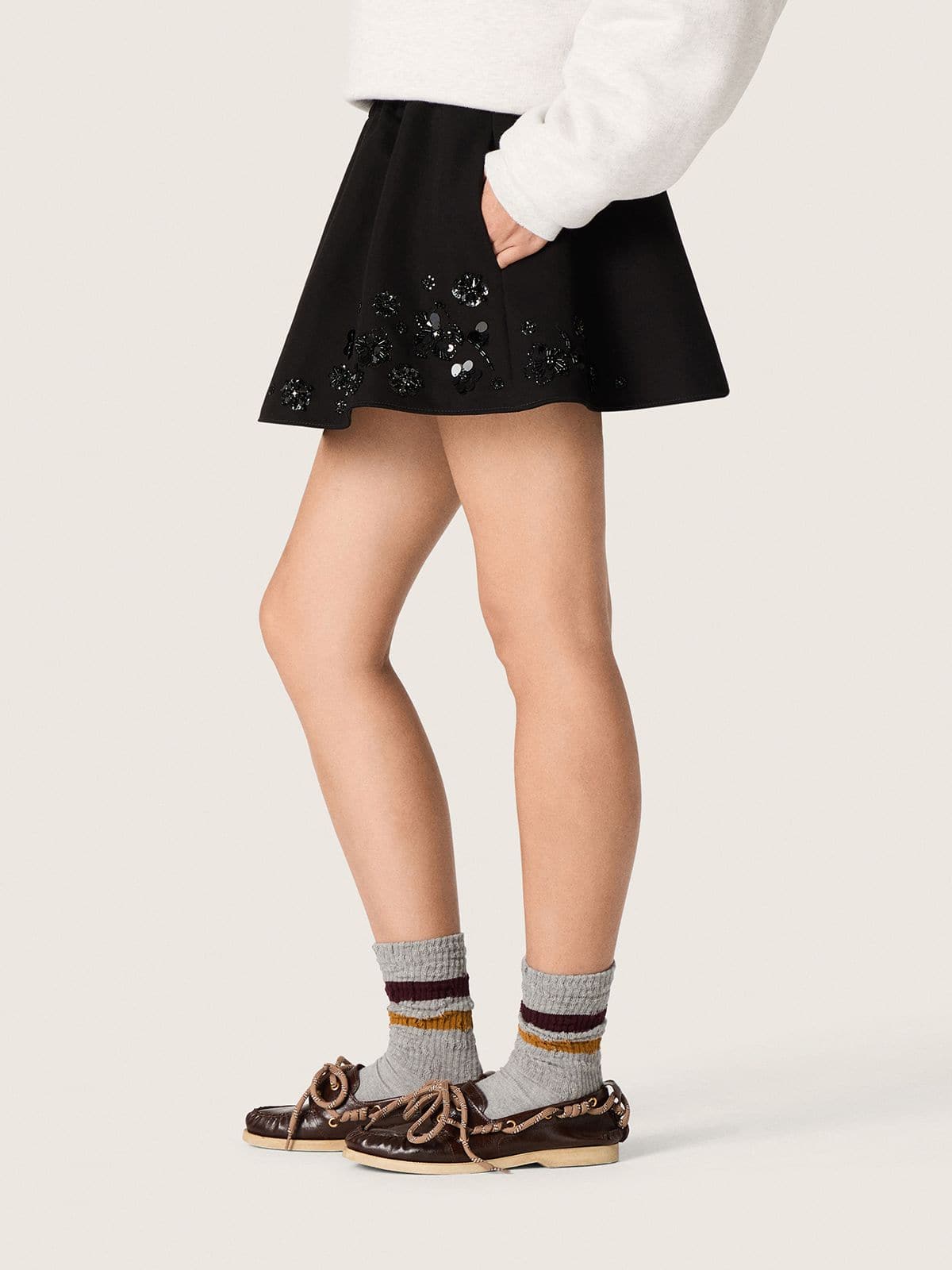 Women’s miniskirt in black cotton twill with floral sequin embroidery