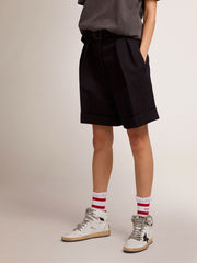 Women's shorts in black wool gabardine with waist belt