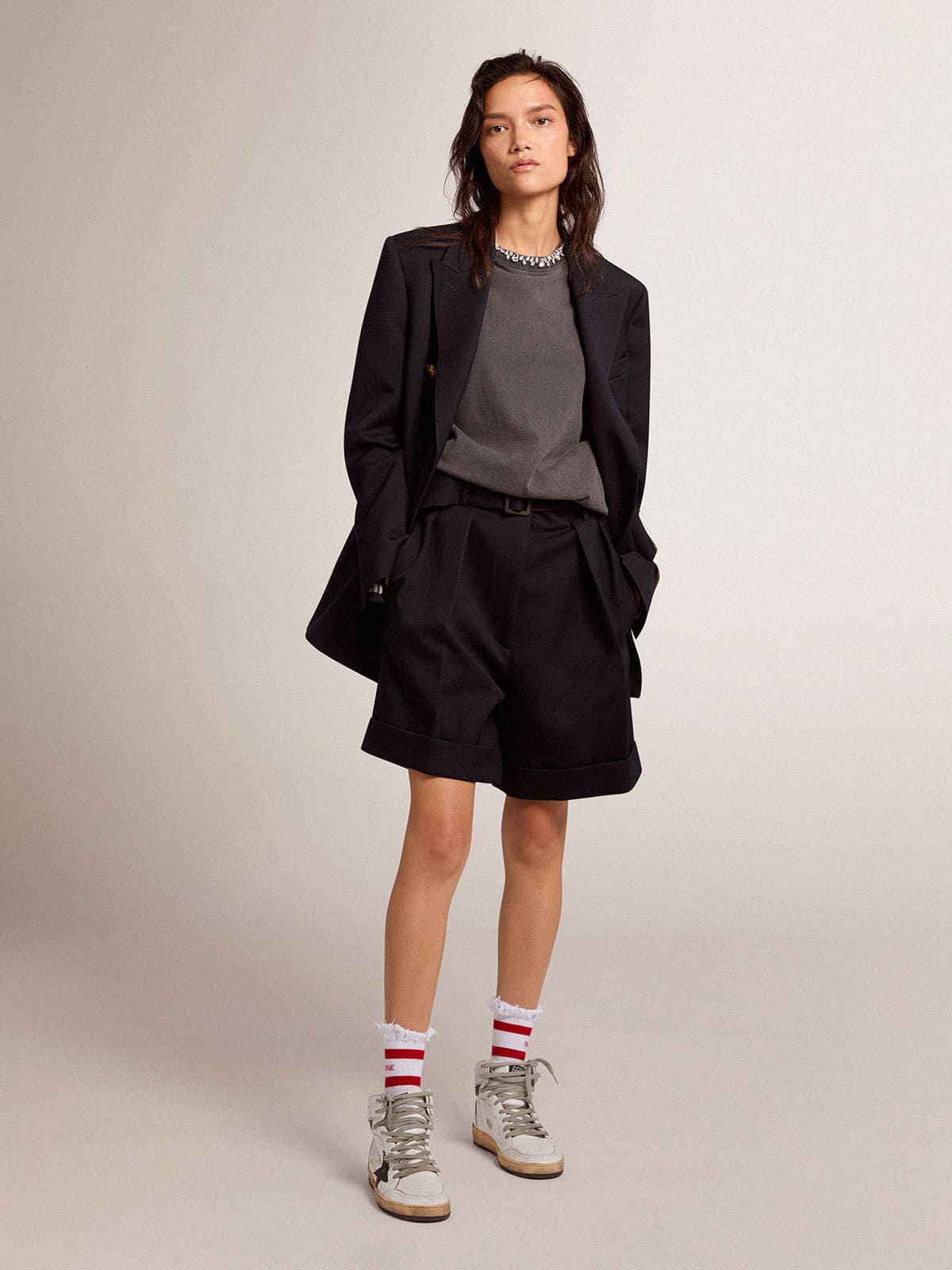 Women's shorts in black wool gabardine with waist belt