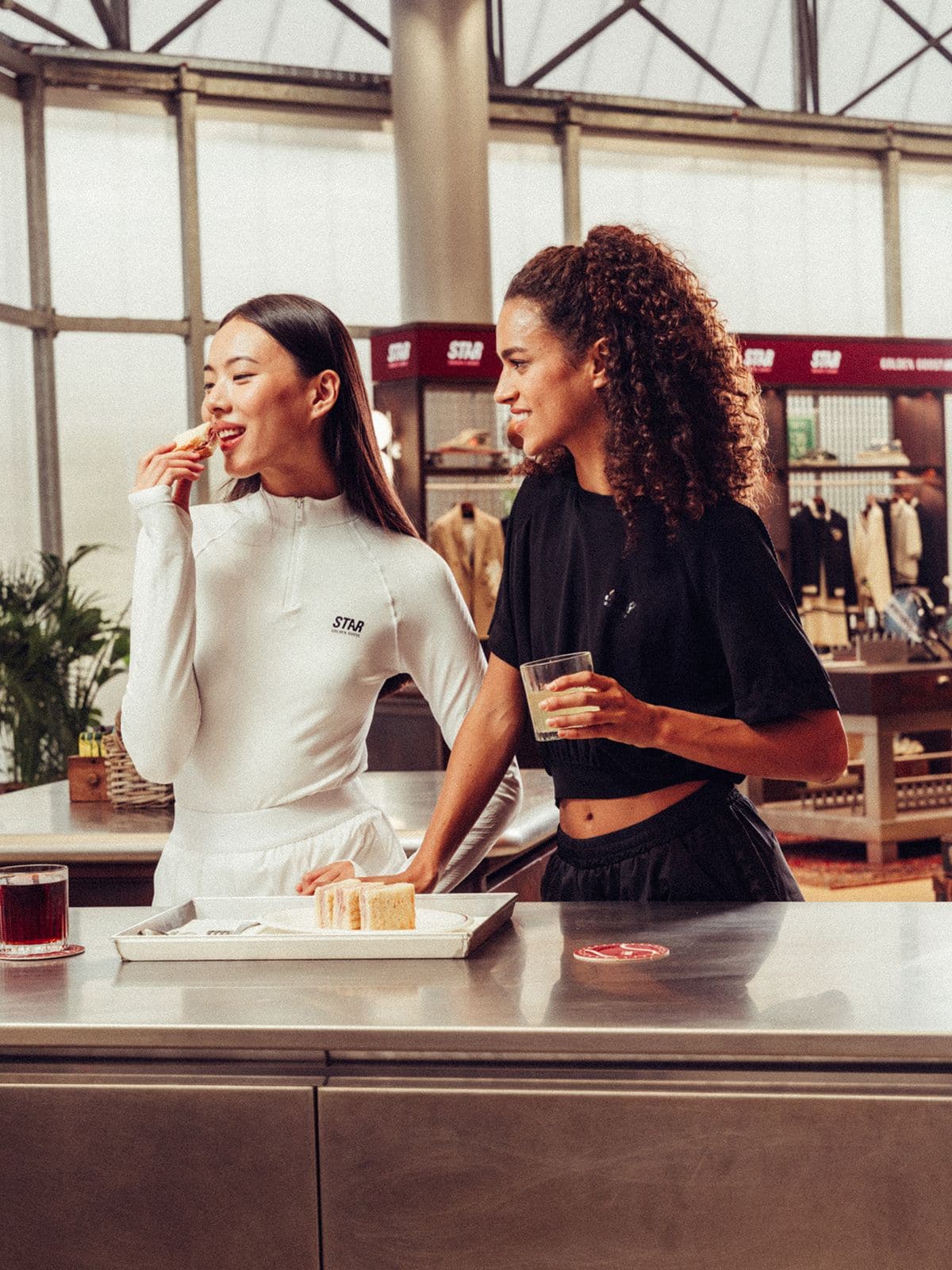 Women's white long-sleeve sports top with zip