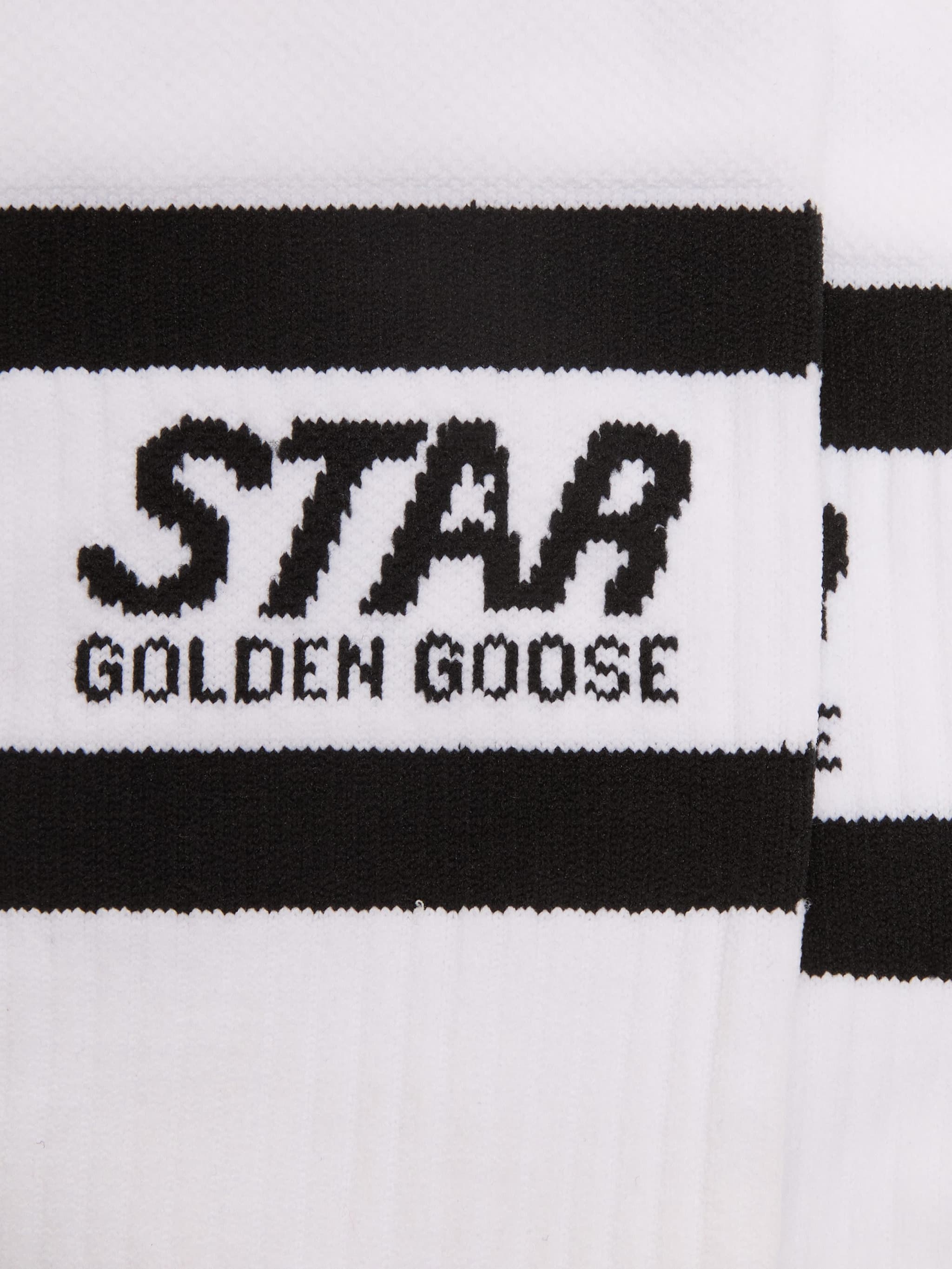 White sports socks with black stripes