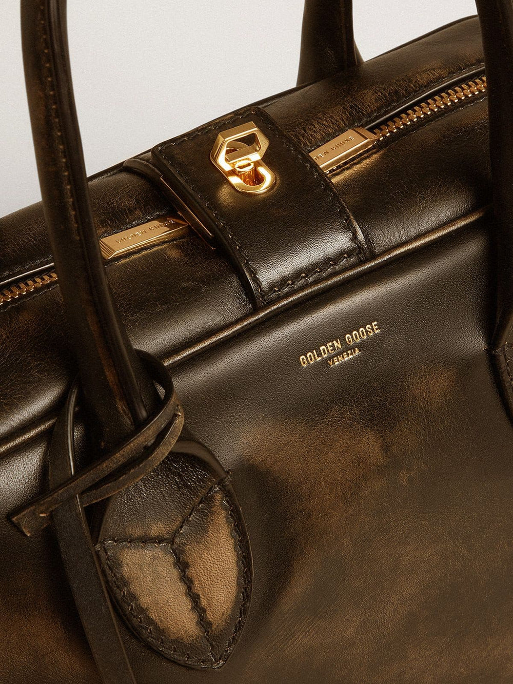 Vita Bag in black distressed leather with gold details