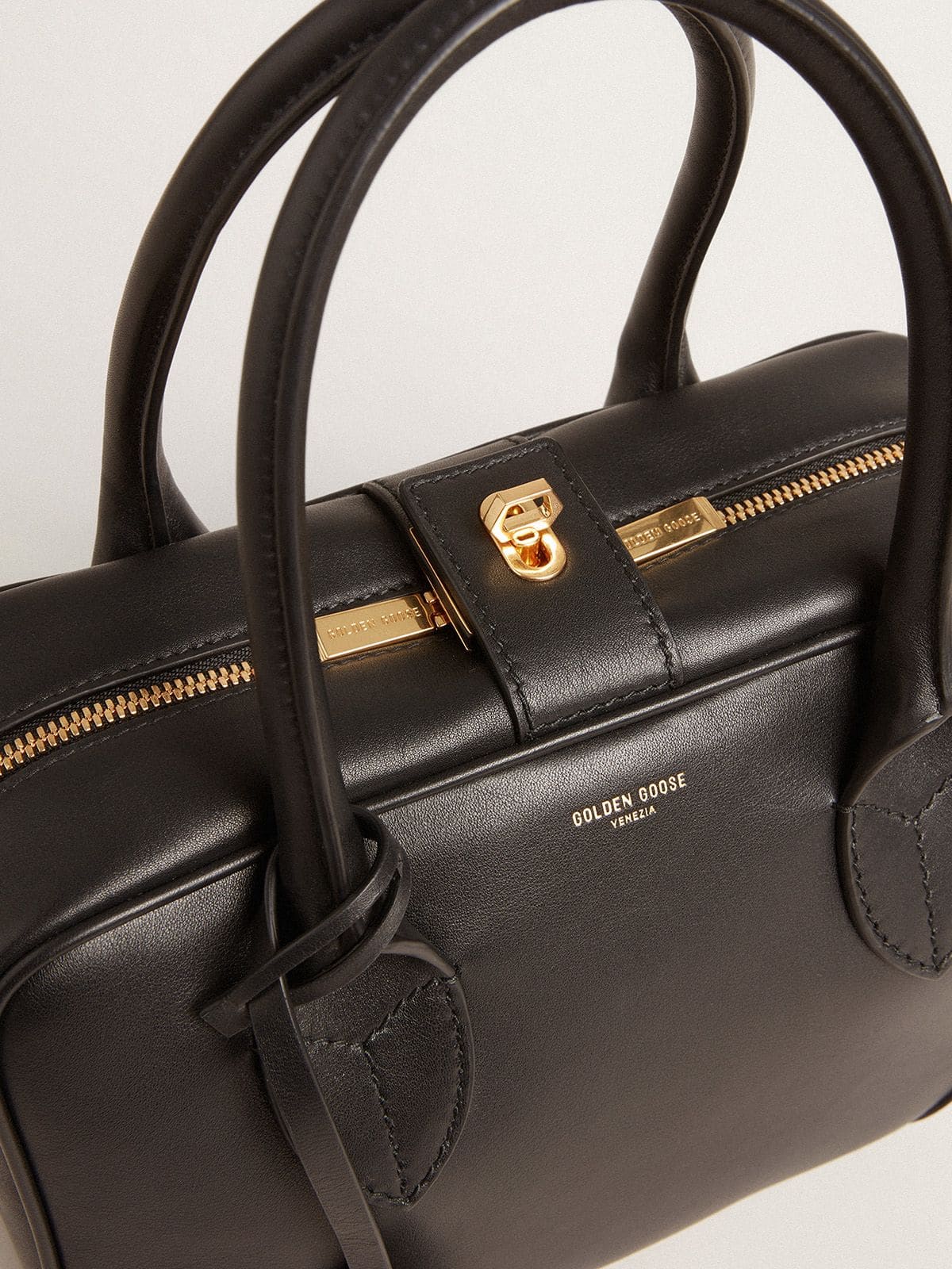Vita Bag in smooth black leather with gold details