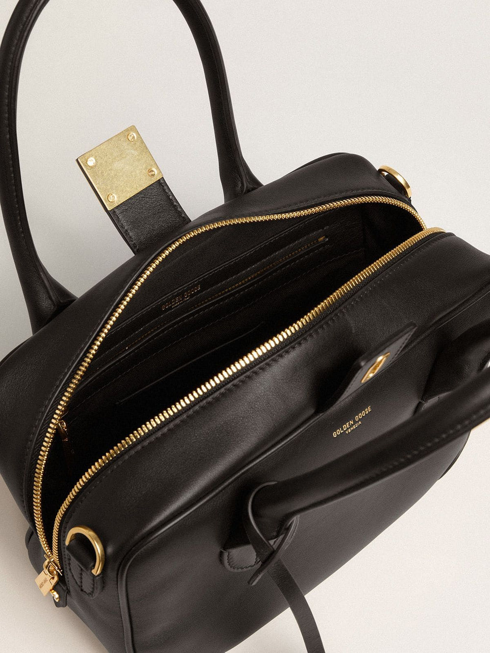 Vita Bag in smooth black leather with gold details