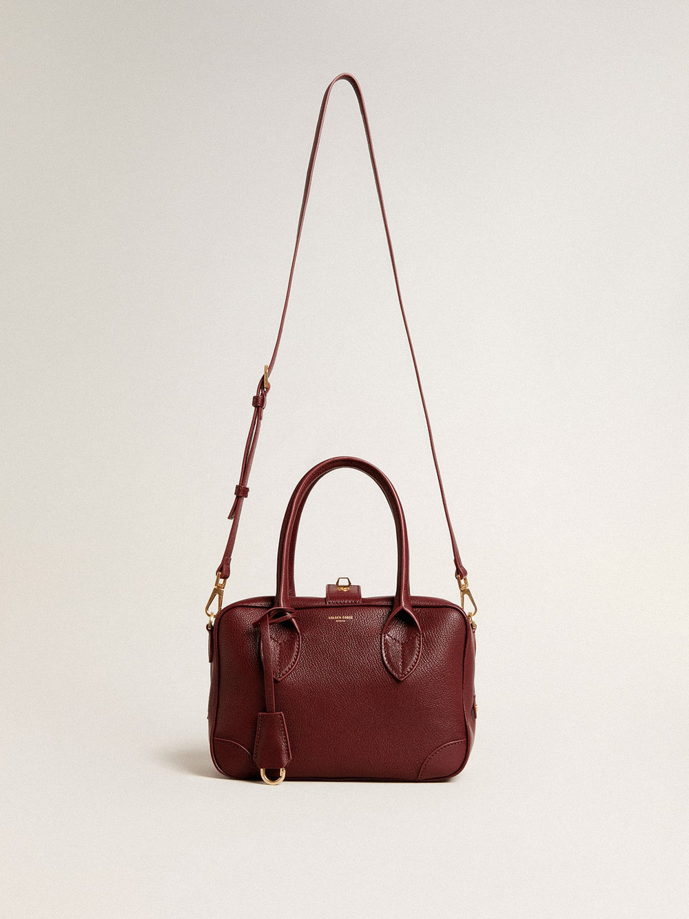 Vita Bag in burgundy leather with gold details