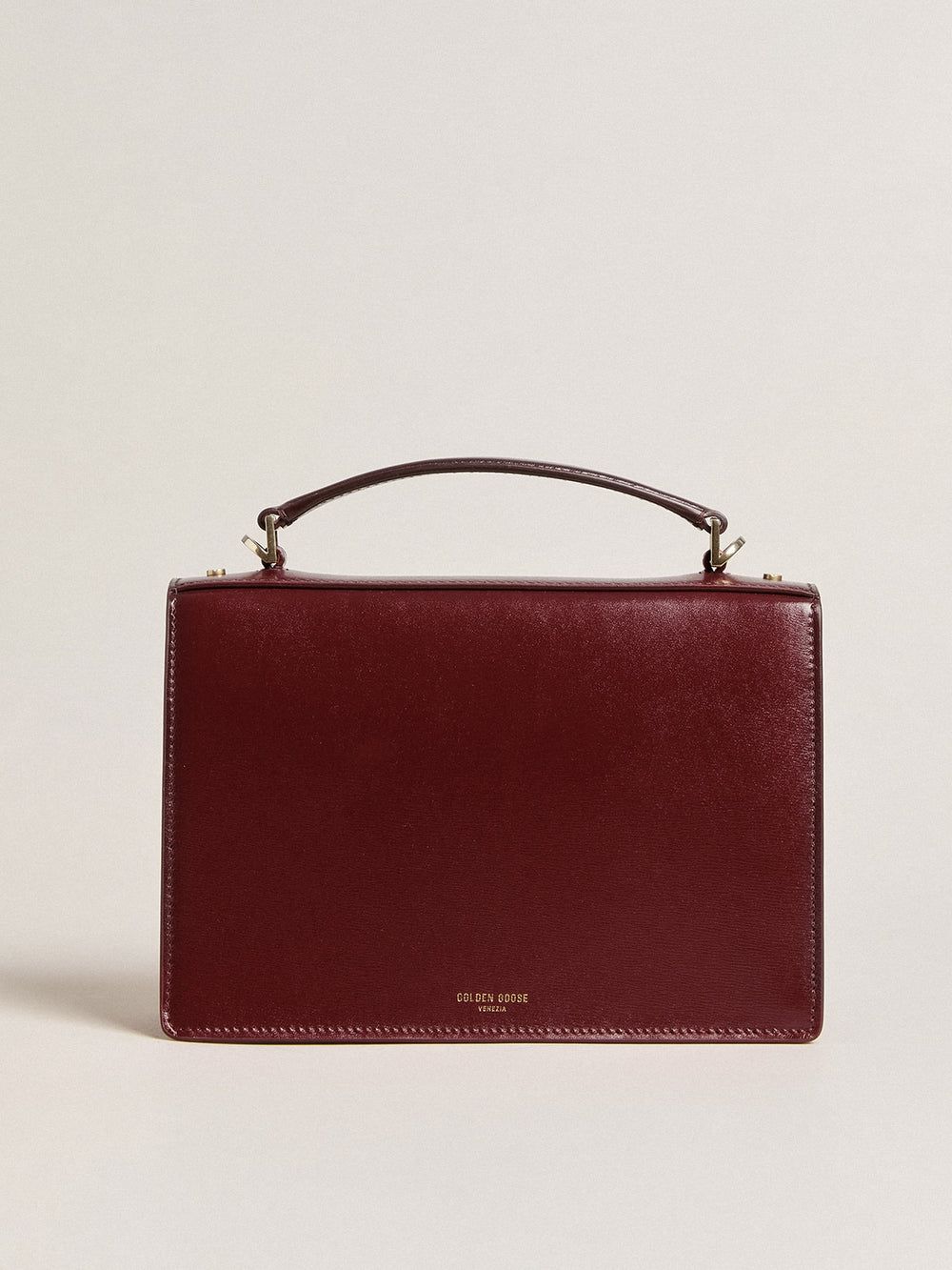 Venezia Bag in burgundy boarded leather with gold details