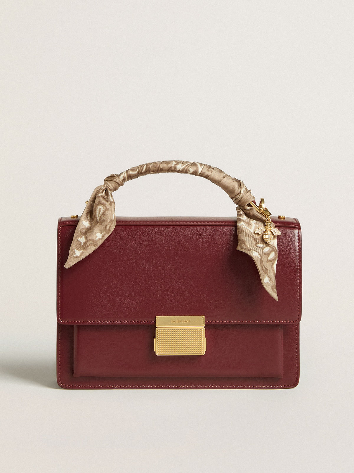 Venezia Bag in burgundy boarded leather with gold details