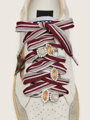 Skins white and burgundy striped laces embellished with charms