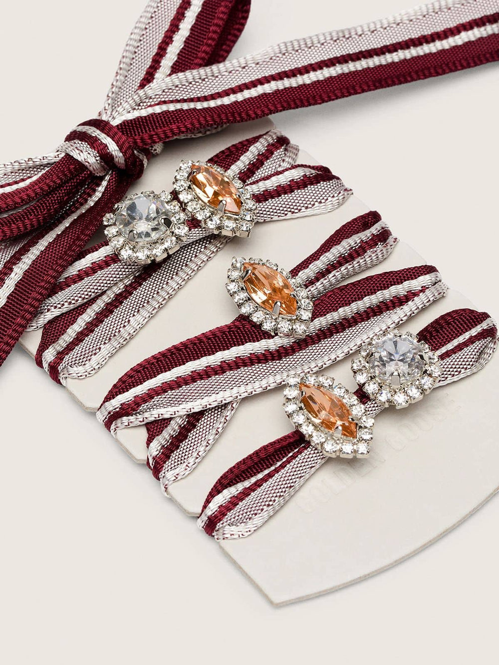 Skins white and burgundy striped laces embellished with charms